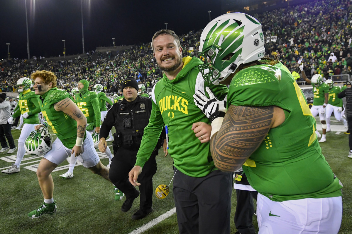 Oregon head coach Dan Lanning celebrates the Ducks' 20-17 win over Utah in an NCAA college football game Saturday, Nov. 19, 2022, in Eugene, Ore.